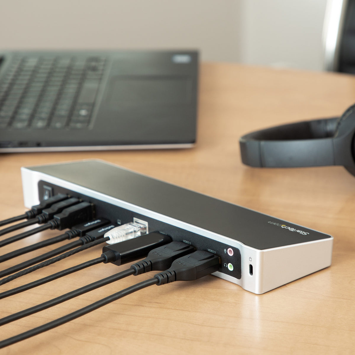 StarTech DK30CH2DPPD dock connected to a laptop on desk