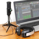 Aluratek AUVM01F microphone beside a computer and headphones