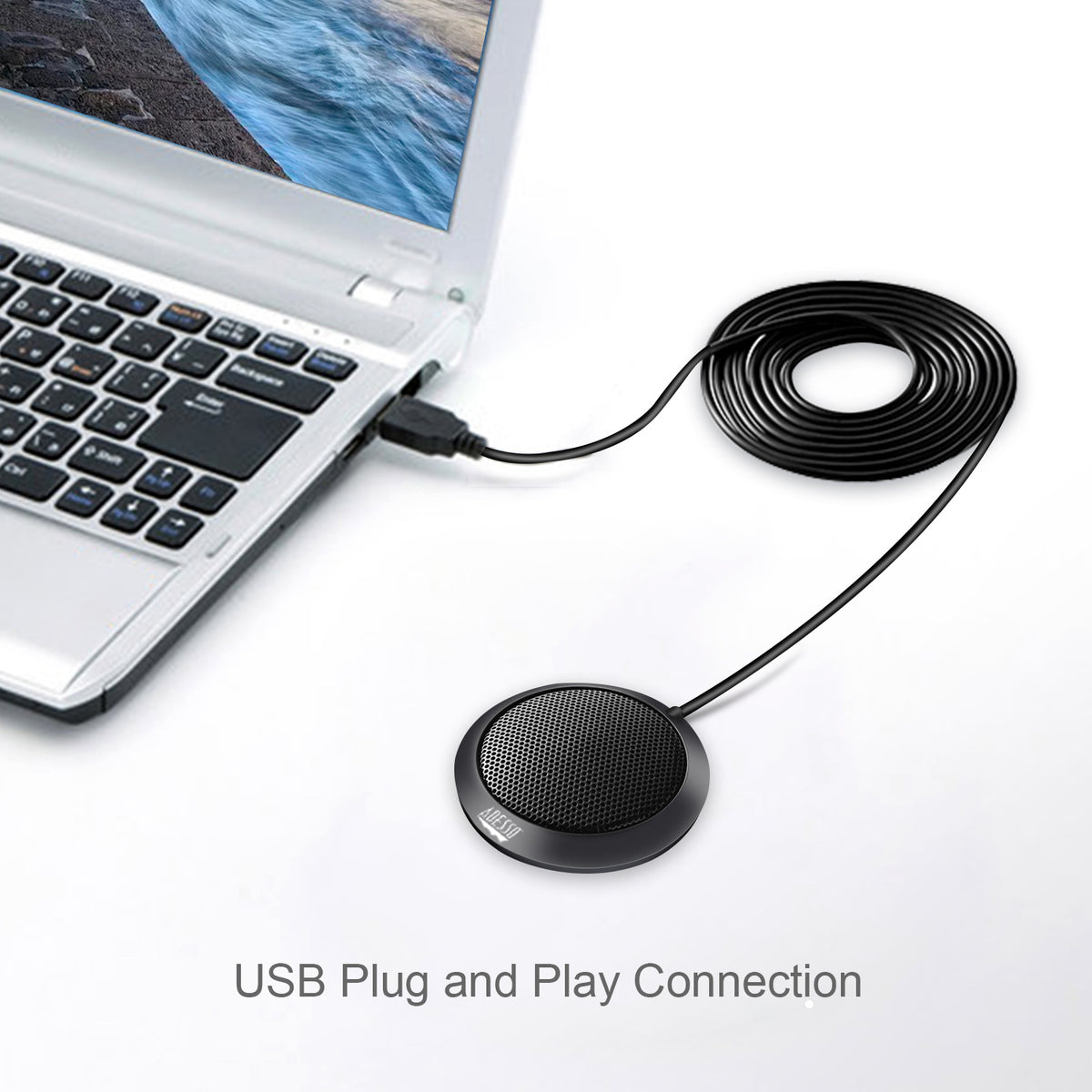 Adesso Xtream M3 USB tabletop microphone connected to a laptop
