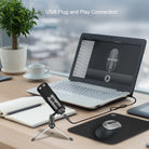 Adesso Xtream M4 microphone and tripod beside a laptop on a desk
